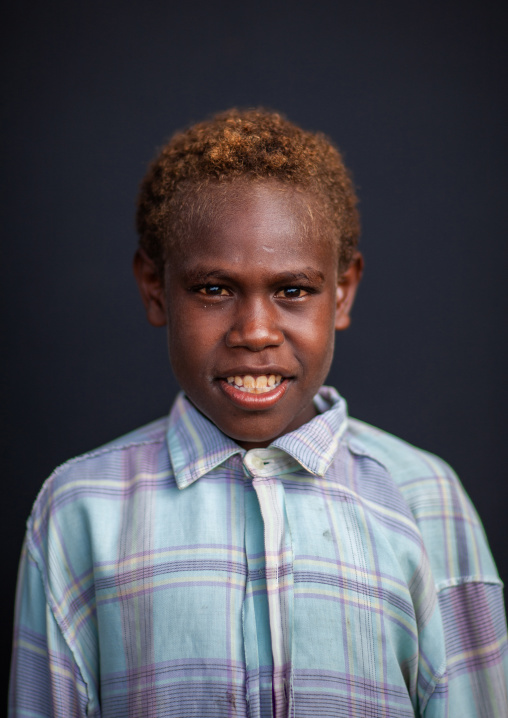 Portrait of a smiling boy dressed to go to church, New Ireland Province, Langania, Papua New Guinea