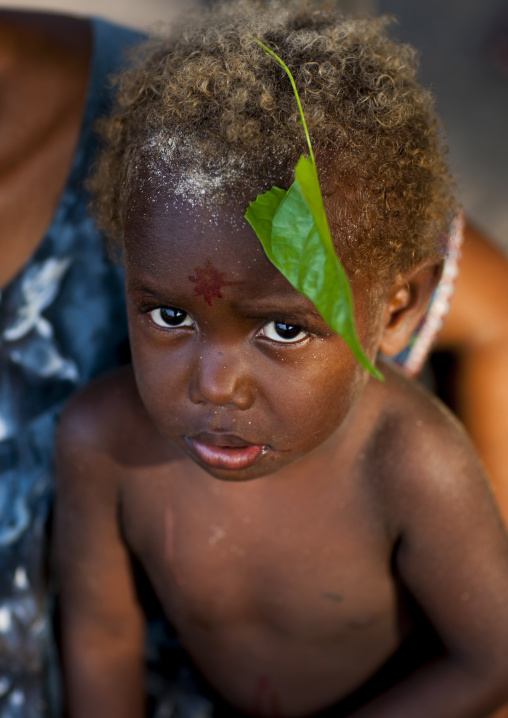 Shy boy with blonde hair, New Ireland Province, Langania, Papua New Guinea