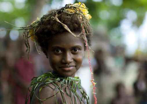 Portrait of a smiling girl during Malagan tatuana masks dance, New Ireland Province, Langania, Papua New Guinea