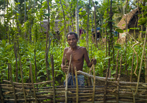 Man in his farm, Milne Bay Province, Trobriand Island, Papua New Guinea