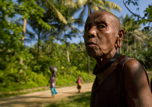 Old mourning woman with shaved head, Milne Bay Province, Trobriand Island, Papua New Guinea