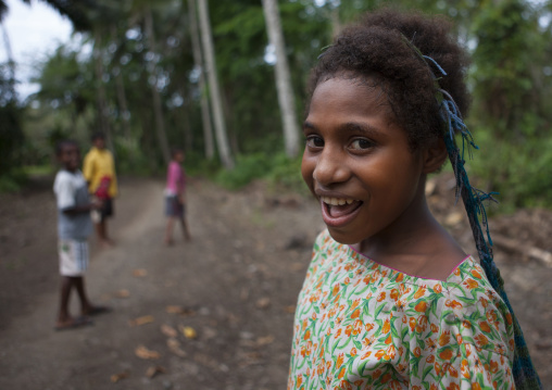 Smiling girl on a road, Milne Bay Province, Alotau, Papua New Guinea