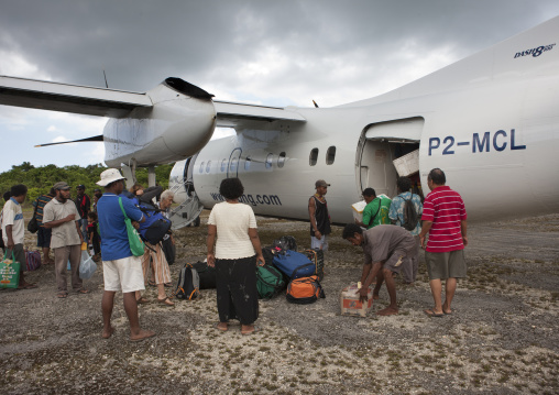 Plane arriving in airport, Milne Bay Province, Trobriand Island, Papua New Guinea
