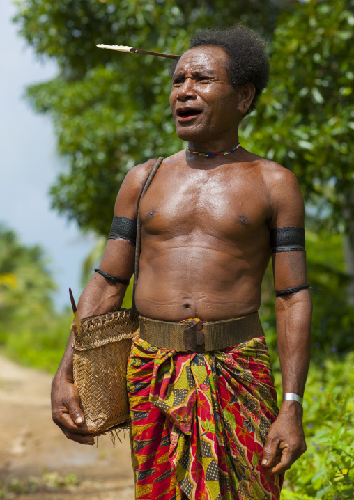 Traditional chief with a betel smile, Milne Bay Province, Trobriand Island, Papua New Guinea