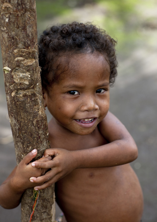Portrait of little boy, Milne Bay Province, Trobriand Island, Papua New Guinea