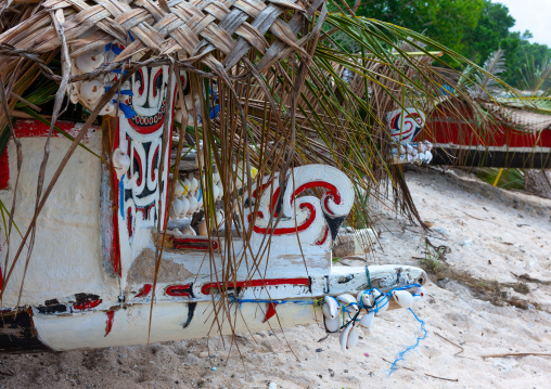 Traditional canoe with carved and painted decorations, Milne Bay Province, Trobriand Island, Papua New Guinea
