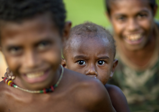 Boys smiling, Milne Bay Province, Trobriand Island, Papua New Guinea
