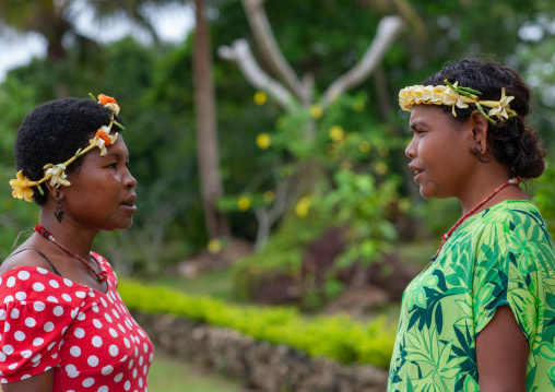 Two women with Floral garlands chatting, Milne Bay Province, Trobriand Island, Papua New Guinea