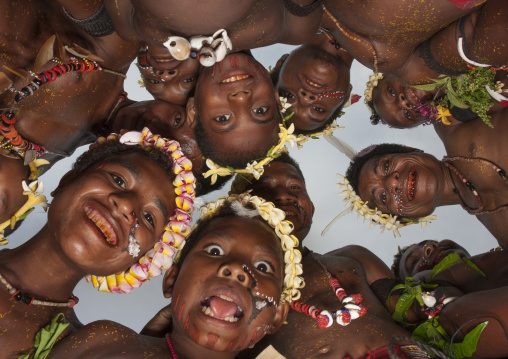 Female tribal dancers looking over, Milne Bay Province, Trobriand Island, Papua New Guinea