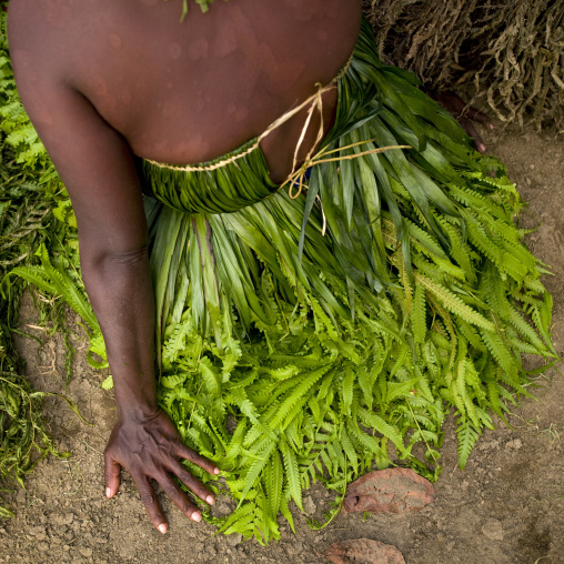 Woman wearing a vegetal skirt, New Ireland Province, Langania, Papua New Guinea