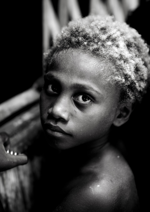 Portrait of a boy with blonde hair, New Ireland Province, Kapleman, Papua New Guinea
