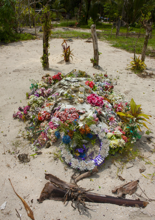 Grave with flowers in a village, New Ireland Province, Laraibina, Papua New Guinea