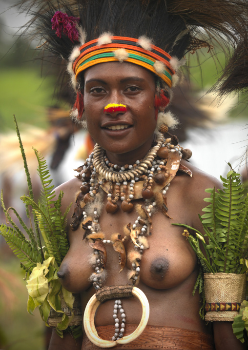 Chimbu tribe young woman with a pig tusks necklace during a Sing-sing, Western Highlands Province, Mount Hagen, Papua New Guinea