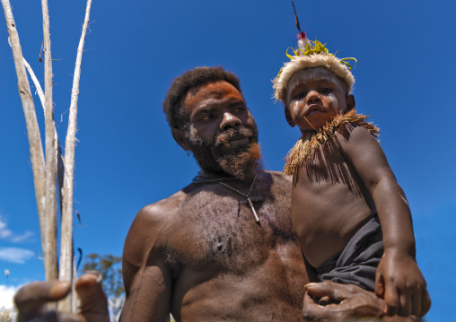 Porttait of a father and his son during a Sing-sing ceremony, Western Highlands Province, Mount Hagen, Papua New Guinea