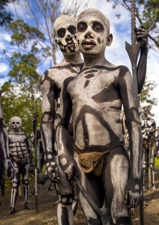 Skeleton tribe boys during a sing-sing ceremony, Western Highlands Province, Mount Hagen, Papua New Guinea