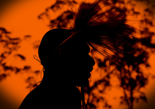 Chimbu tribe man silhouette during a sing sing, Western Highlands Province, Mount Hagen, Papua New Guinea