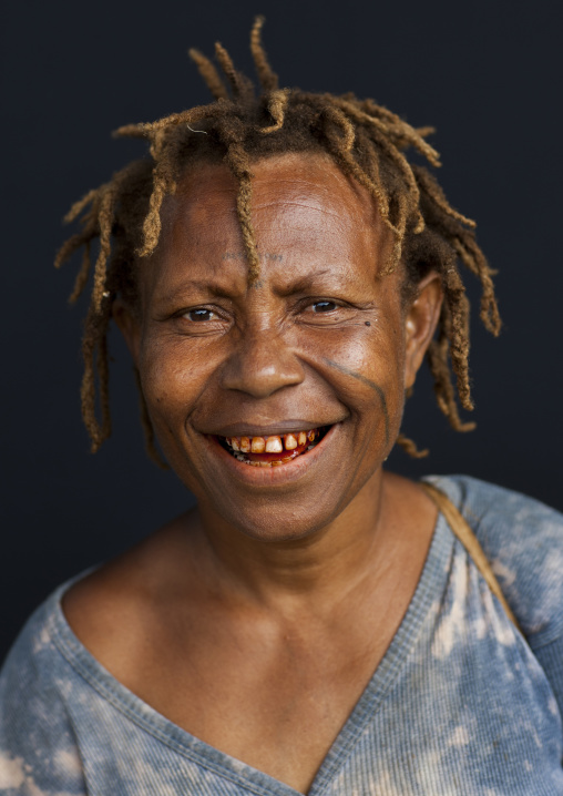 Portrait of a local woman with tattoos on the face, New Ireland Province, Langania, Papua New Guinea