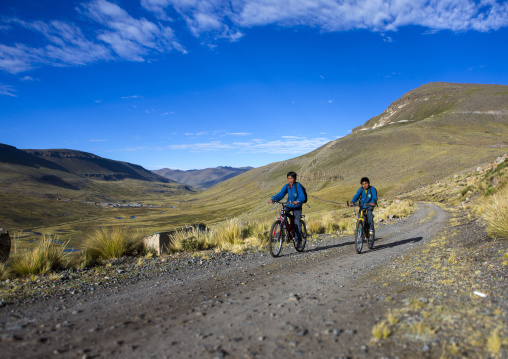 Children On Bicycles In The Mountain, Cuzco, Peru
