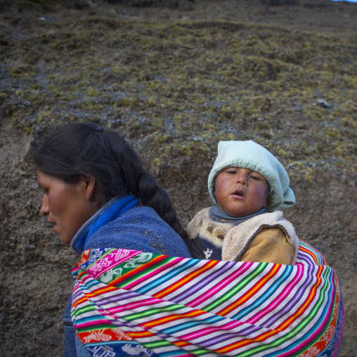 Peruvian Mother And Baby Climbing To The Qoyllur Riti Festival, Ocongate Cuzco, Peru