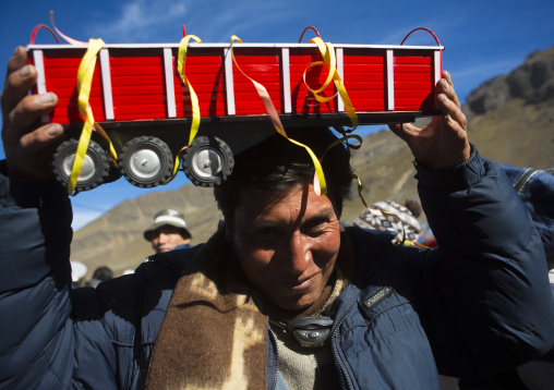 Man With A Toy Tractor Bought At Qoyllur Riti Festival, Ocongate Cuzco, Peru