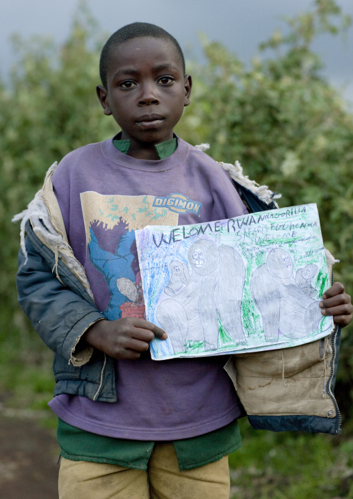 Rwandan boy showing his gorilla drawing in volcanoes national park area, Lake Kivu, Ibwiwachu, Rwanda