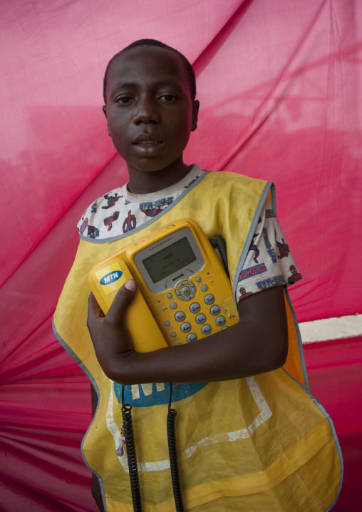 Rwandan man with a mtn phone in the market, Lake Kivu, Gisenye, Rwanda