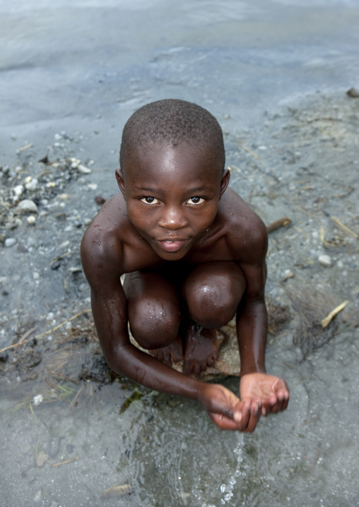 Rwandan boy washing, Lake Kivu, Gisenye, Rwanda
