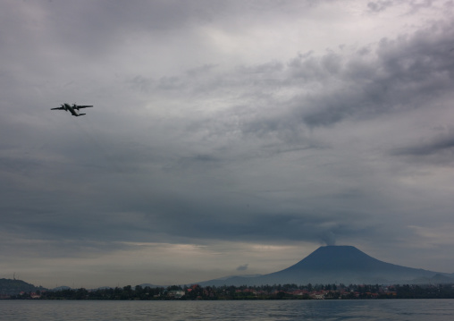 Plane taking off in front of nyiragongo congo volcano, Lake Kivu, Gisenye, Rwanda