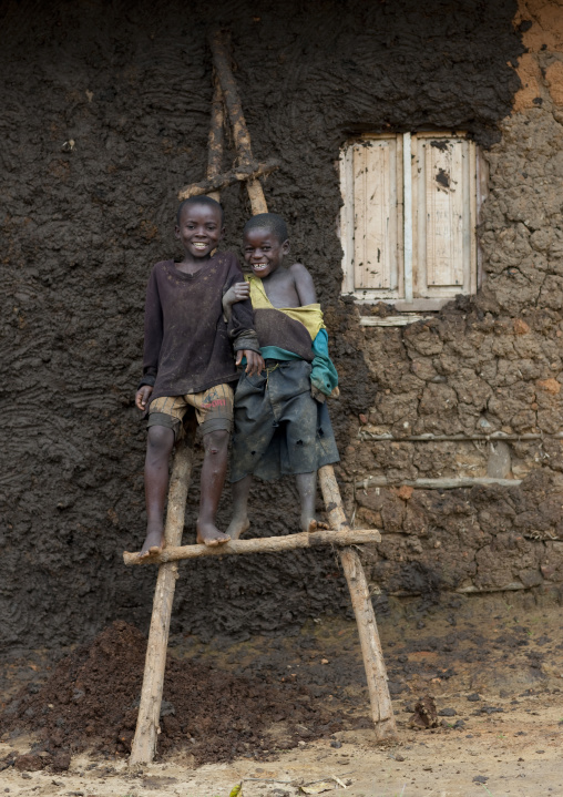 Batwa tribe boys on a ladder, Western Province, Cyamudongo, Rwanda