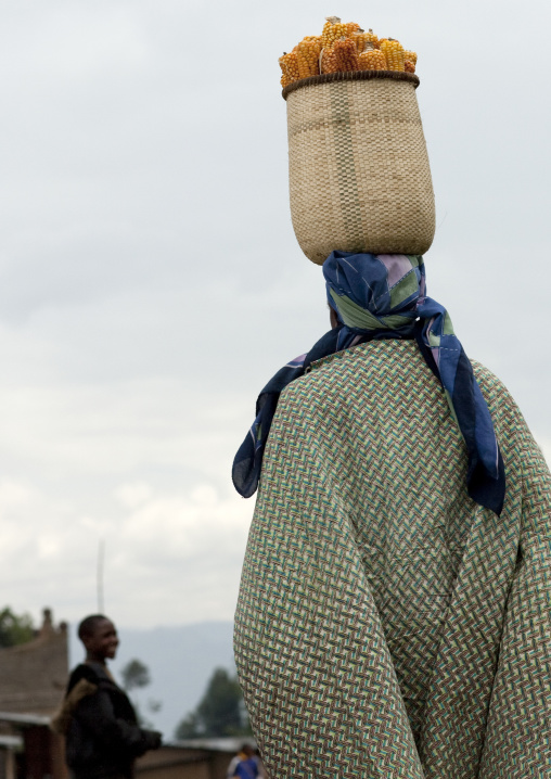 Woman carrying a basket on her head, Northwest Province, Rehengeri, Rwanda
