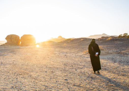 Saui woman in niqab in the desert of Madain Saleh, Al Madinah Province, Alula, Saudi Arabia