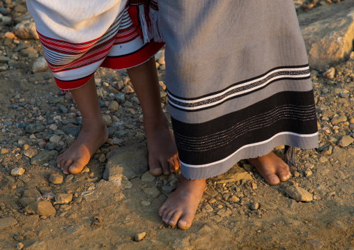 Two barefoot children wearing futhas, Jizan province, Alaydabi, Saudi Arabia