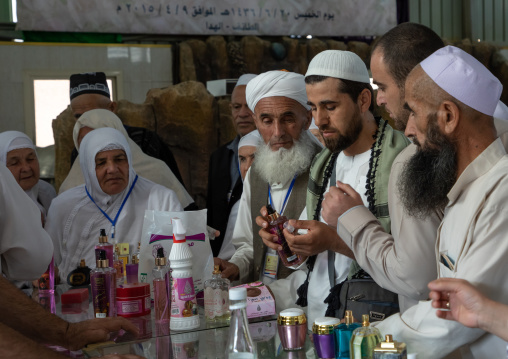 Group of indonesian pilgrims back from hajj buying souvenirs in a rose factory, Mecca province, Taïf, Saudi Arabia