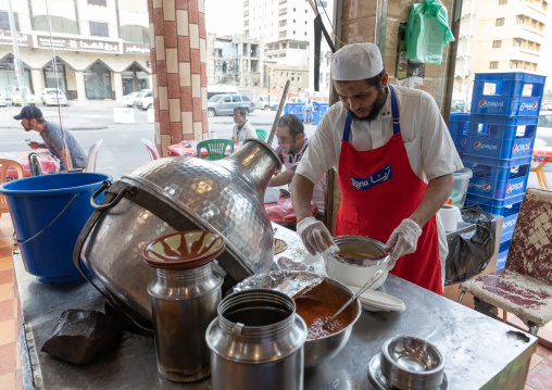 Cook preparing foul in a local restaurant, Mecca province, Jeddah, Saudi Arabia
