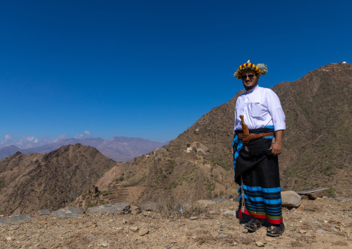Portrait of a flower man wearing a floral crown on the head in the mountain, Jizan Province, Addayer, Saudi Arabia