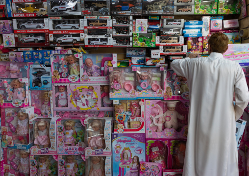 Saudi man buying toys in a shop, Jizan Province, Sabya, Saudi Arabia