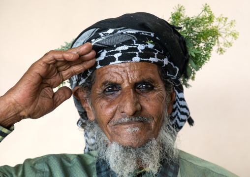 Portrait of a flower man wearing a floral crown on the head, Jizan Province, Mahalah, Saudi Arabia