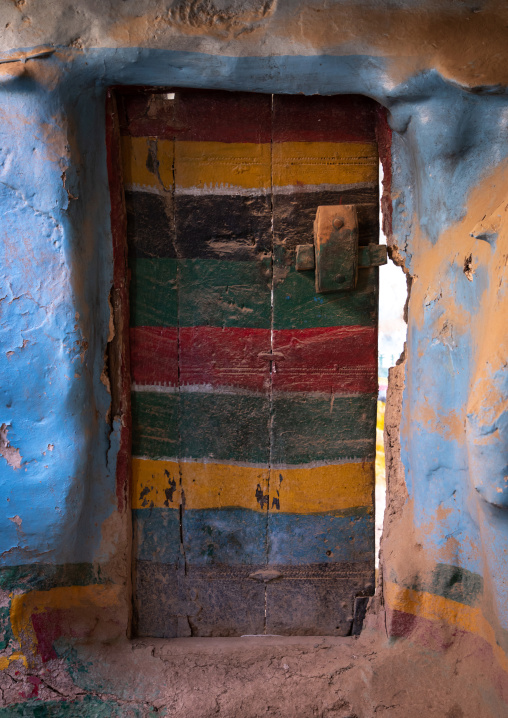 Colorful wooden door of an abandonned asiri house, Asir province, Sarat Abidah, Saudi Arabia