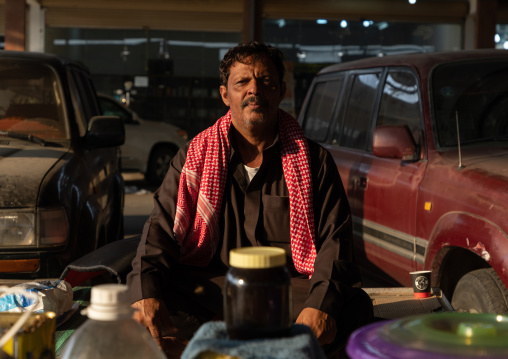 Saudi man selling honey and honeycombs on a market, Asir province, Al Habeel, Saudi Arabia