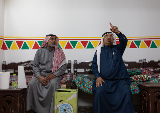 Saudi men inside a traditional house, Asir province, Tanomah, Saudi Arabia
