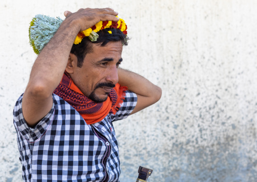 Portrait of a flower man making a floral crown on his head, Jizan Province, Addayer, Saudi Arabia