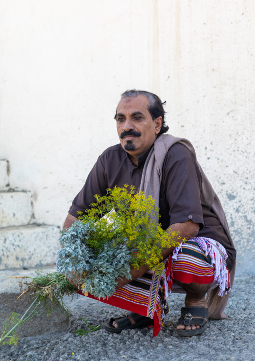 Portrait of a flower man with a floral crown in the hand, Jizan Province, Addayer, Saudi Arabia