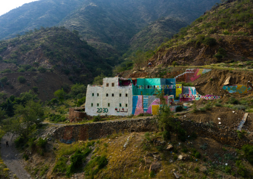 Aerial view of an old traditional house with 2030 logo on the facade, Asir province, Rijal Alma, Saudi Arabia