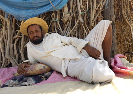 Yemeni refugee man resting on a bed, Jizan Province, Jizan, Saudi Arabia