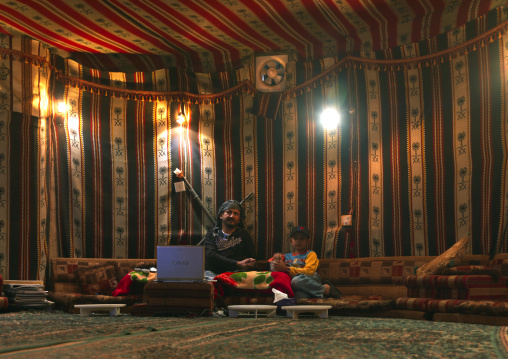 Saudi man inside a room decorated as a tent, Fifa Mountains, Al-Sarawat, Saudi Arabia