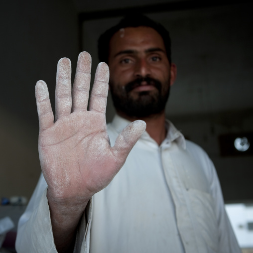 Yemeni refugee saying hello with the hand, Asir province, Sarat Abidah, Saudi Arabia