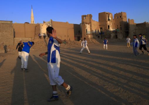 People playing football in the old town, Najran Province, Najran, Saudi Arabia