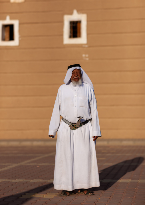 Old saudi man in traditional clothing and wearing a jambyia, Najran Province, Najran, Saudi Arabia
