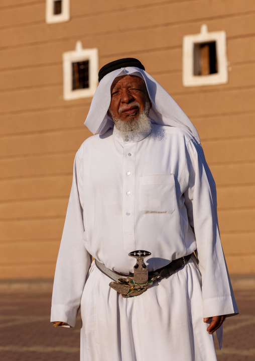 Old saudi man in traditional clothing and wearing a jambyia, Najran Province, Najran, Saudi Arabia
