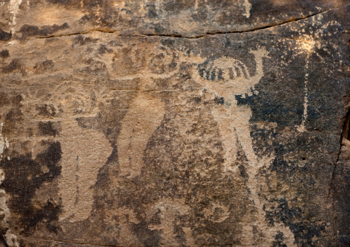 Petroglyphs on a rock depicting women dancing, Najran Province, Abar Himma, Saudi Arabia